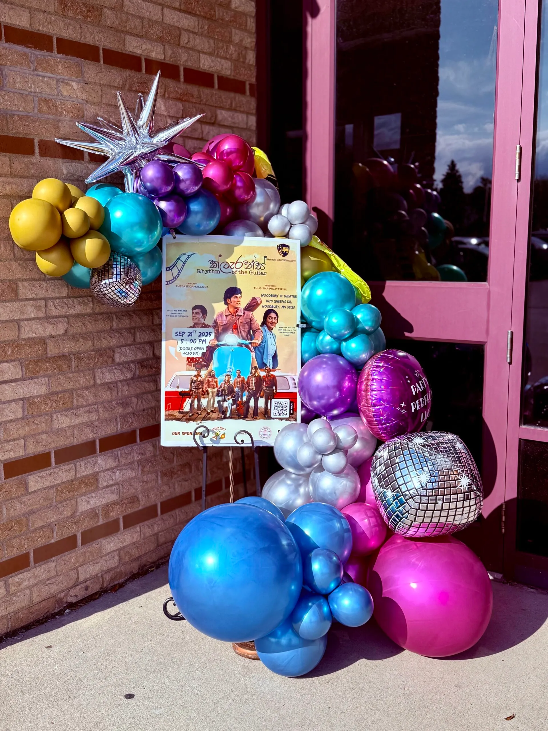 Balloon garland and backdrop styled for a celebration